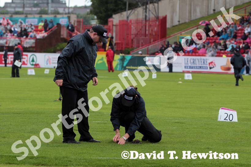 Trying to prise the shot from the sodden turf at the European Athletics Team Championships.